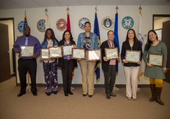 Logistics staff members receiving awards